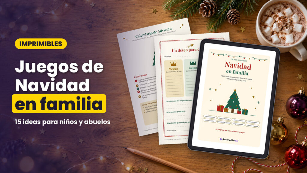 Juegos de Navidad en familia: imprimibles del pack (calendario de Adviento y carta a los Reyes Magos) sobre una mesa de madera con tablet, chocolate caliente y adornos navideños
